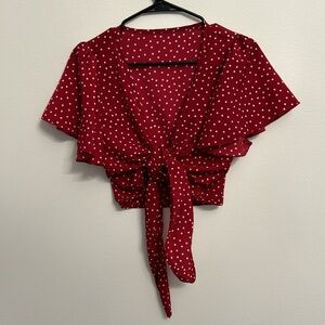 Red Polka dot, front tie top. Never been worn.